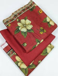 Red fabric with floral patterns on a white background