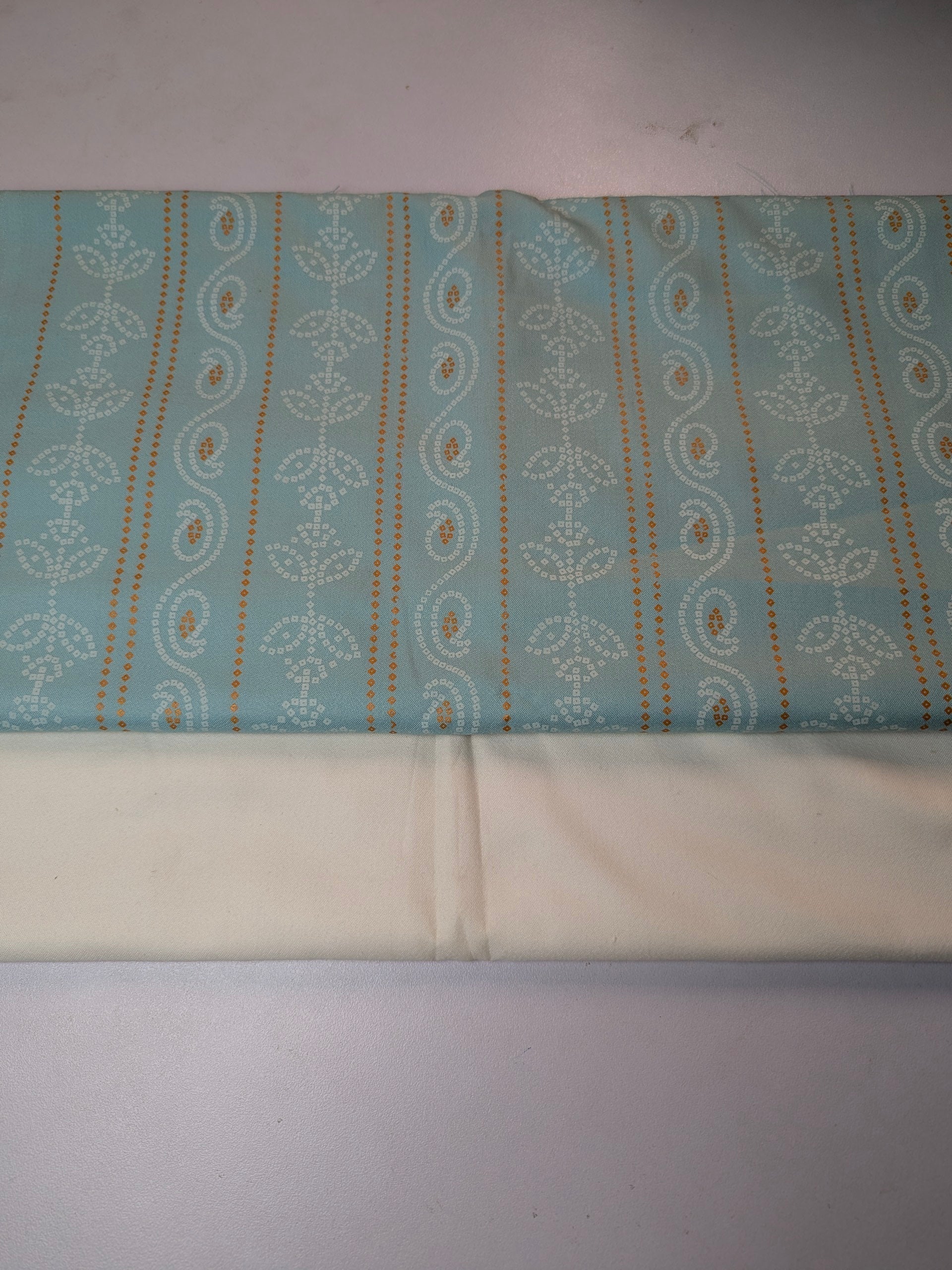 Fabric with a pattern on a plain background